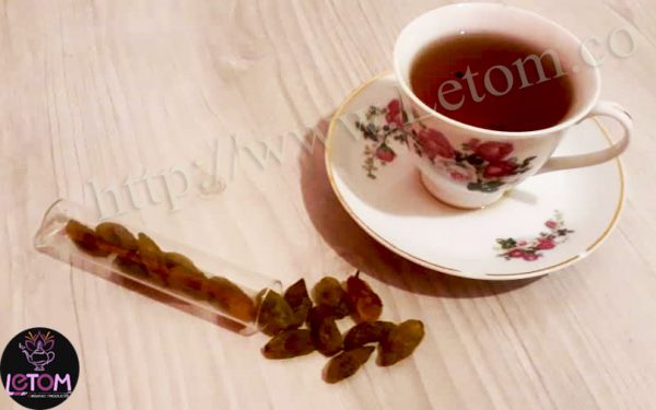 Organic natural raisins (dried fruit) with a cup of tea