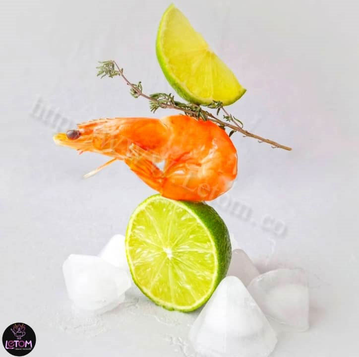 A photo of shrimp and lemon
