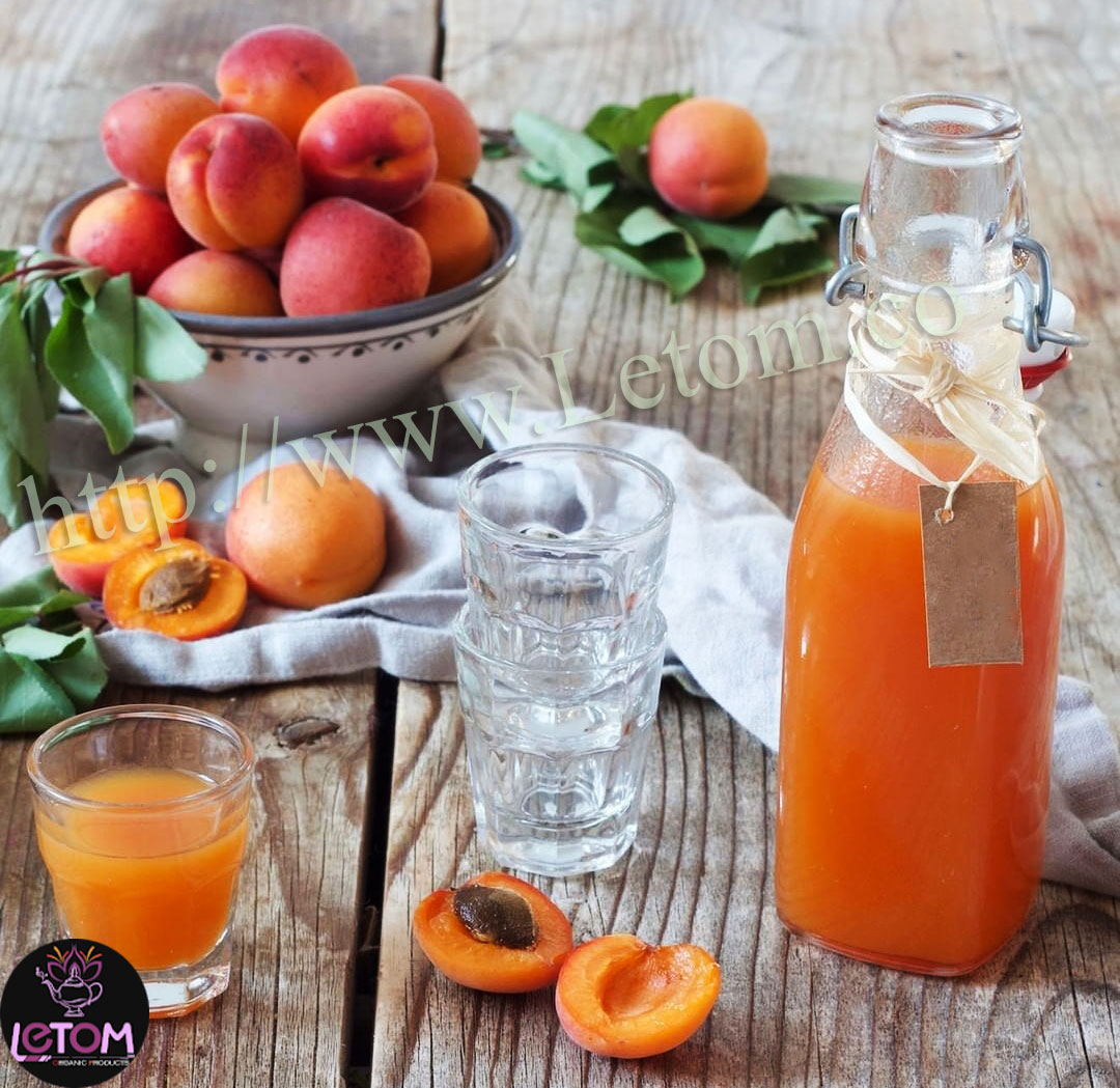 Fresh apricots and natural fruit juice in a glass