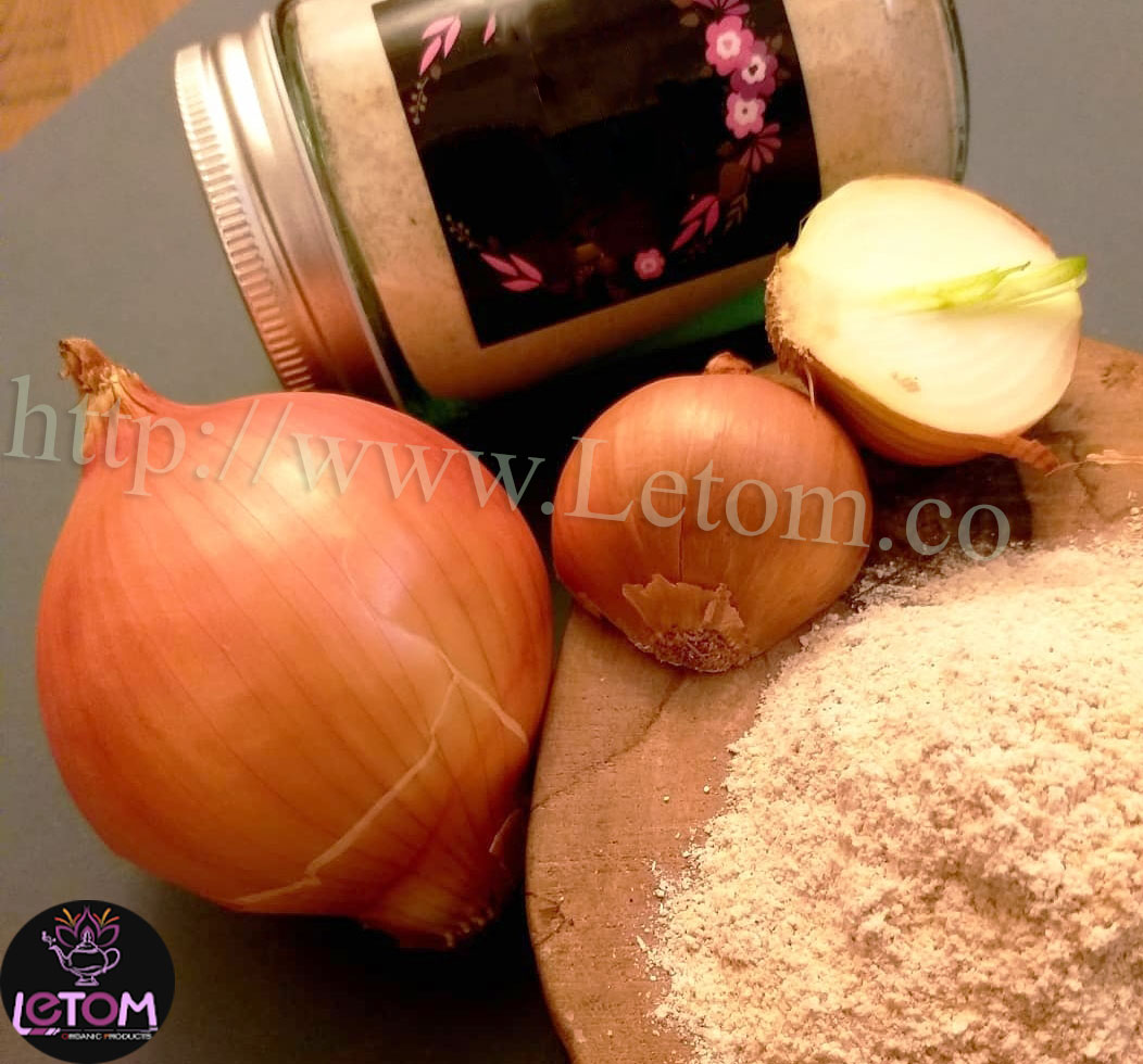 Onion powder in a bowl and natural onions