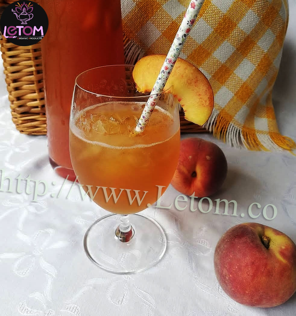 Natural peach juice in a glass