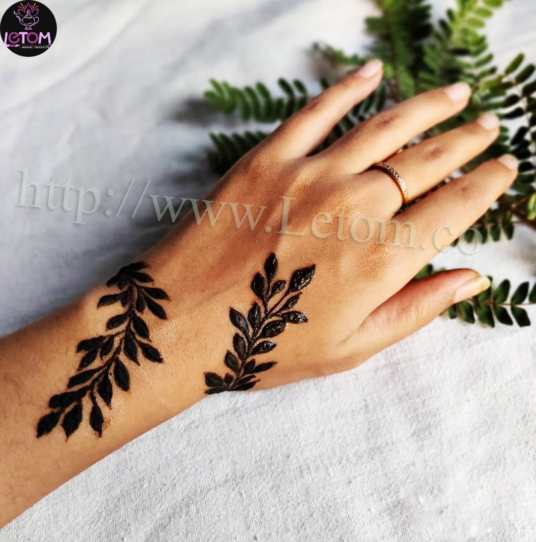 Hand design with herbs