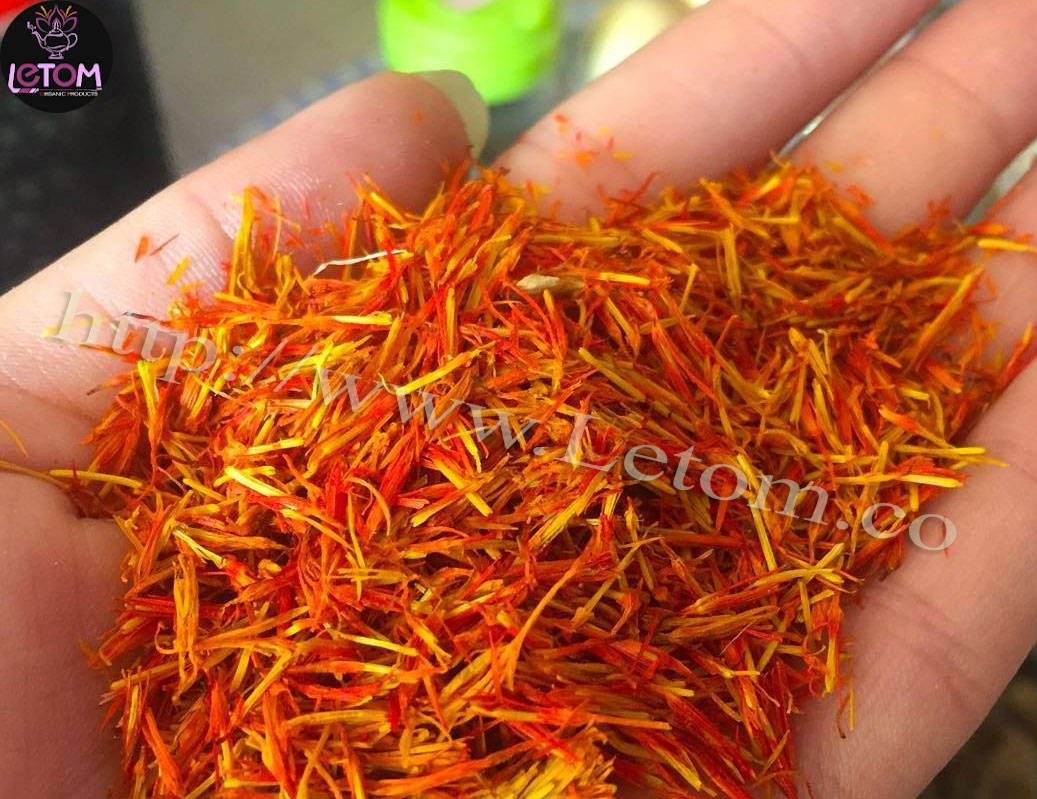 safflower in the hands of a farmer