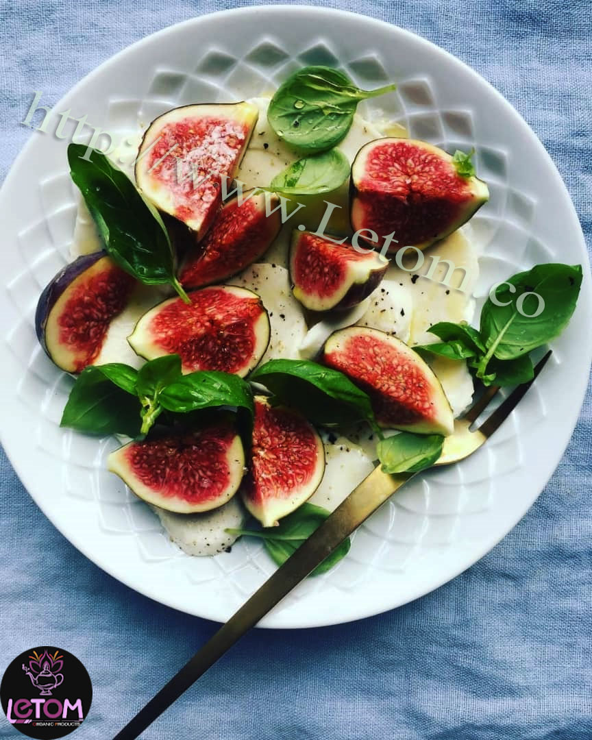 The best natural fresh figs with vegetables on a plate