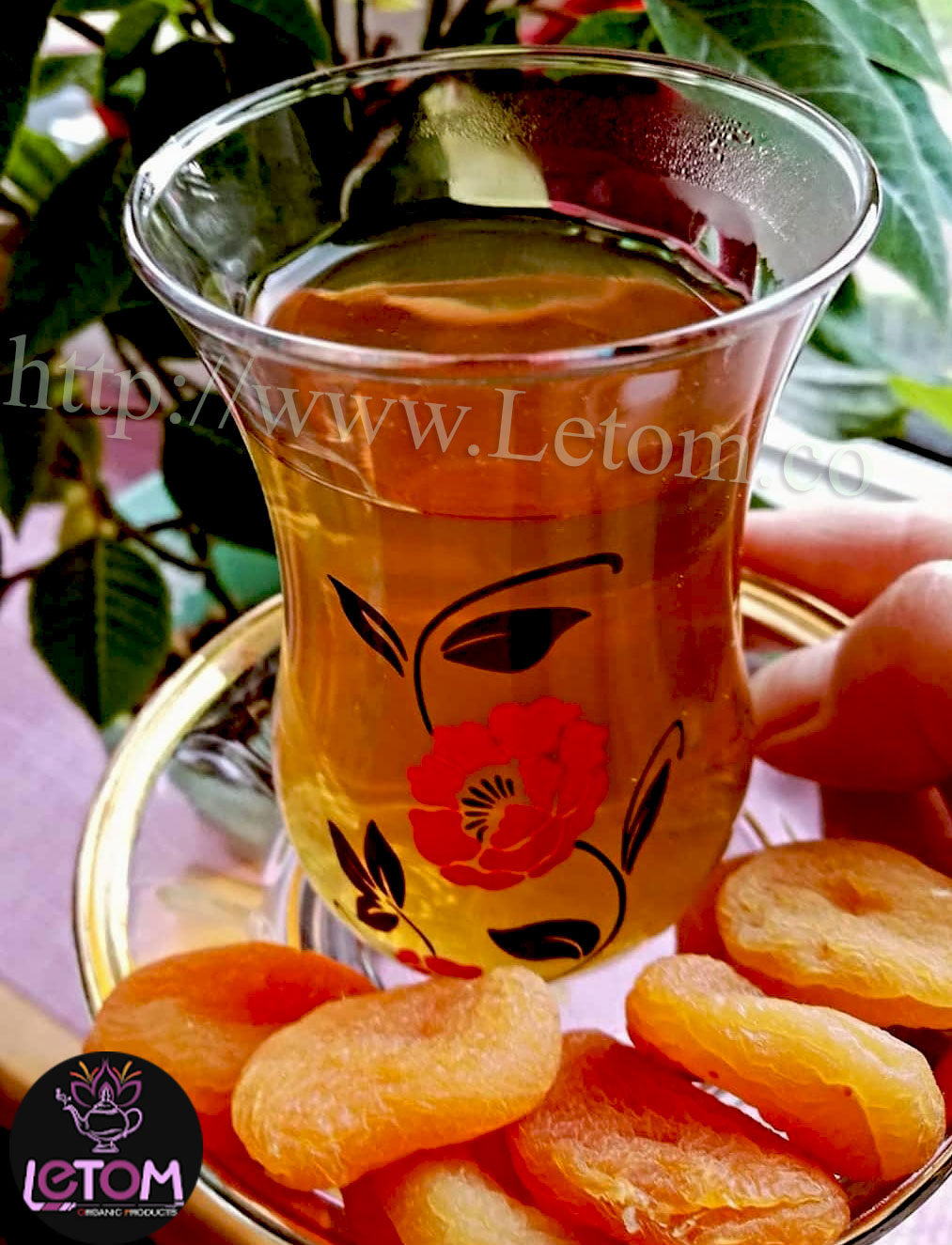 apricots next to a cup of black tea