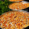 Dried apricots on a tray and in wholesale