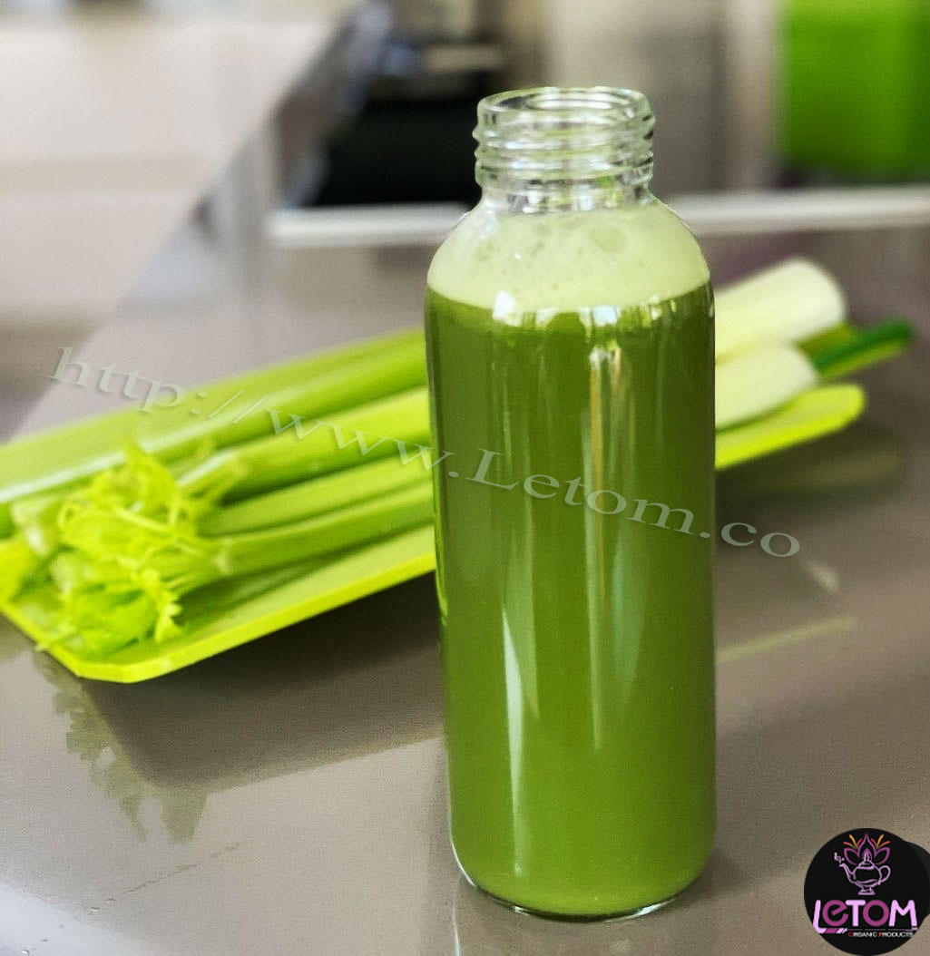 A photo of celery drink next to celery, one of the strongest fat burners